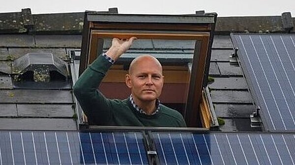 Max inspecting solar panels